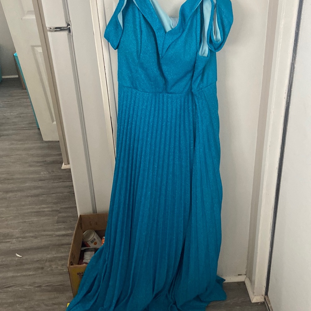 A blue sparkly prom Dress it was woren once.  But it’s to big for me. Its a 3x.
